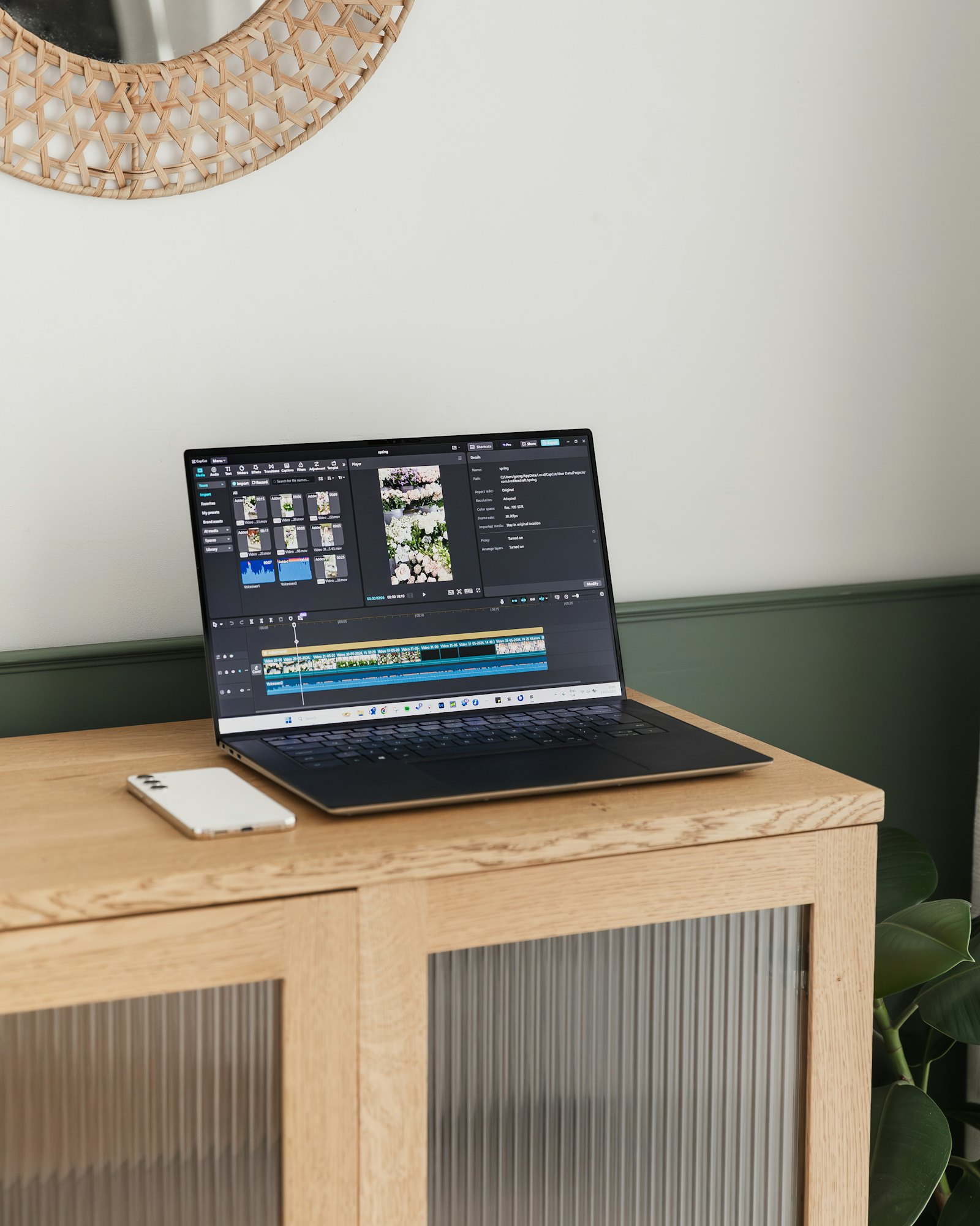 A laptop screen showing video editing software with a project timeline open